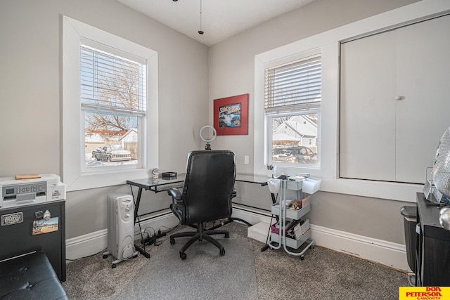 carpeted home office featuring baseboards