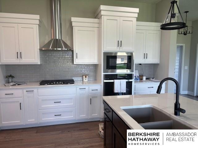 21802 Parkview Dr, Gretna, NE 68028 - kitchen featuring stainless steel appliances, white cabinetry, and wall chimney range hood