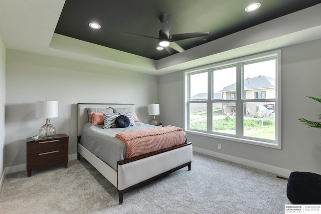 21802 Parkview Dr, Gretna, NE 68028 - bedroom featuring a tray ceiling, light carpet, recessed lighting, and a ceiling fan