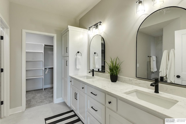 21802 Parkview Dr, Gretna, NE 68028 - bathroom featuring double vanity and a walk in closet