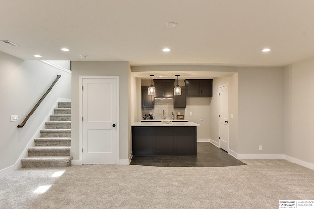 21802 Parkview Dr, Gretna, NE 68028 - kitchen featuring dark colored carpet, light countertops, recessed lighting, decorative backsplash, and pendant lighting