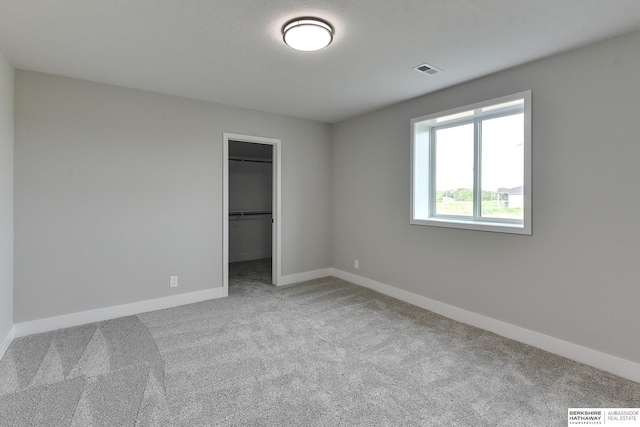 21802 Parkview Dr, Gretna, NE 68028 - unfurnished bedroom featuring carpet, a walk in closet, and a closet