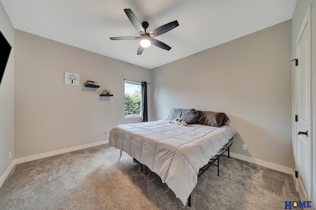 carpeted bedroom featuring ceiling fan and baseboards