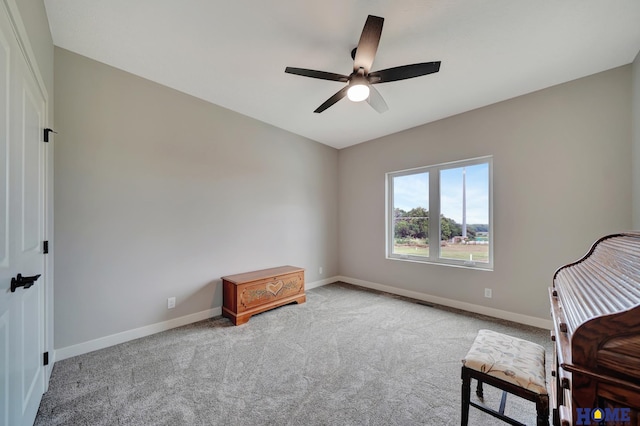 bedroom with baseboards, a ceiling fan, and light colored carpet