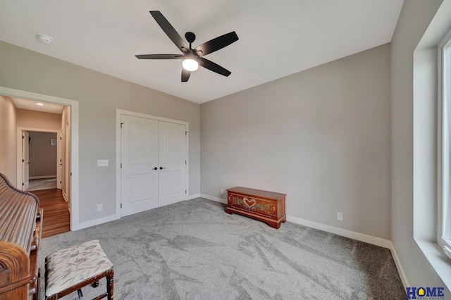 unfurnished room featuring carpet floors, ceiling fan, and baseboards