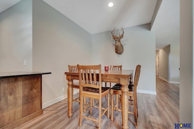 dining space with baseboards, recessed lighting, and light wood-style floors