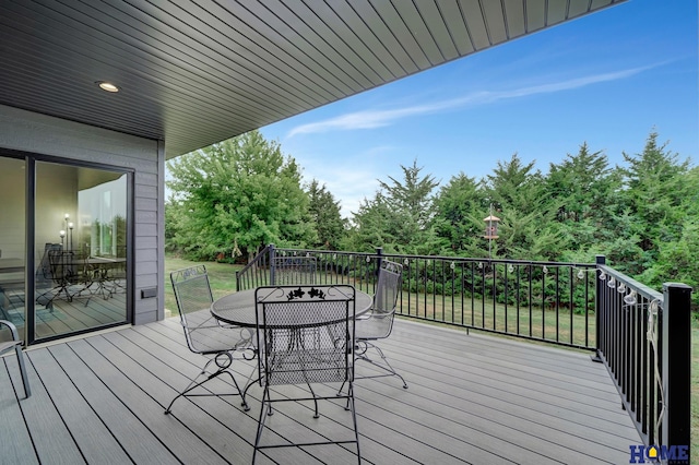 wooden deck with outdoor dining area