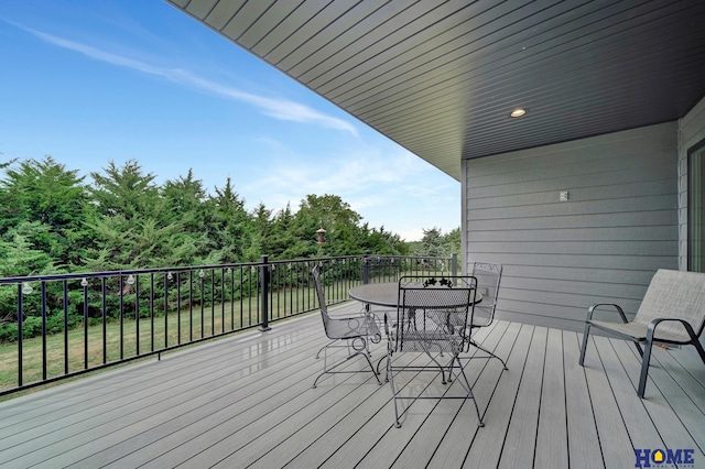 deck with outdoor dining space