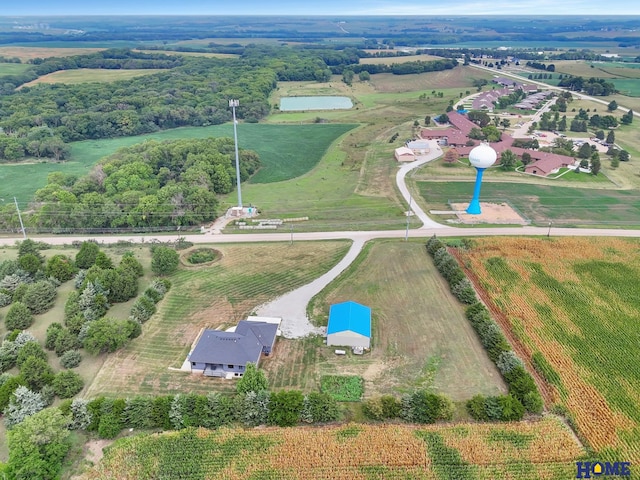 birds eye view of property with a rural view