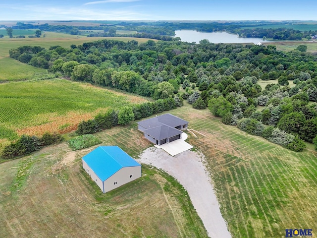 birds eye view of property with a rural view and a water view