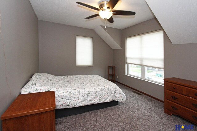 bedroom featuring carpet, visible vents, vaulted ceiling, and baseboards