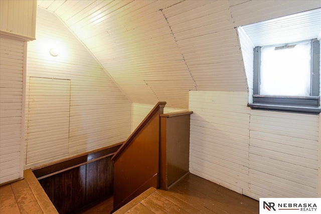 corridor featuring wooden ceiling, vaulted ceiling, an upstairs landing, and wood finished floors