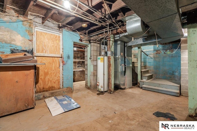 unfinished below grade area featuring gas water heater, stairway, and heating unit