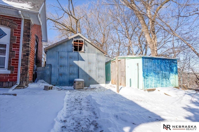 exterior space with a shed and an outbuilding