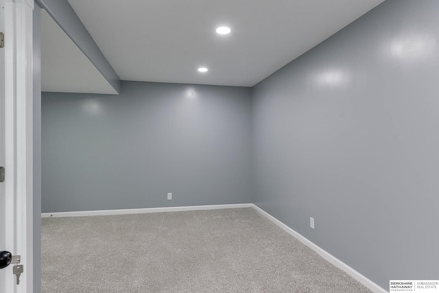 carpeted spare room with baseboards and recessed lighting