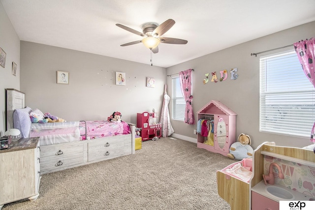 bedroom featuring a ceiling fan, light carpet, and baseboards