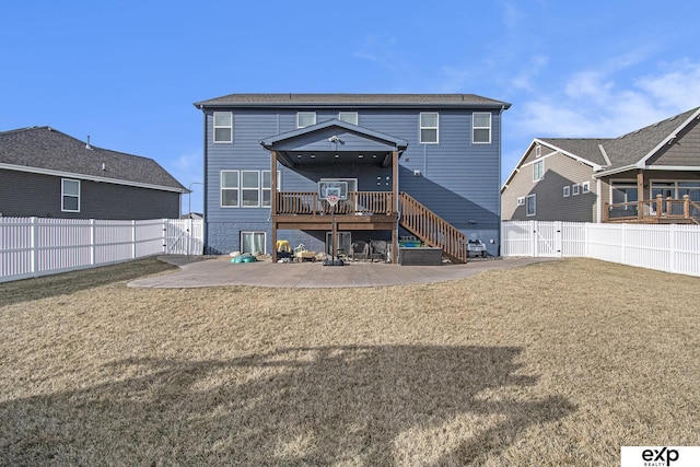 rear view of property featuring a patio area, a fenced backyard, stairs, and a lawn