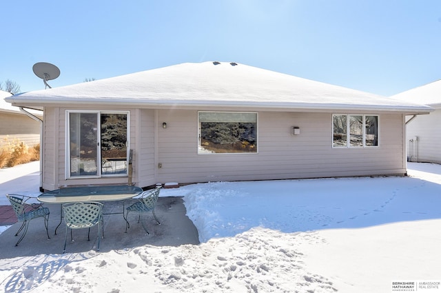 view of snow covered house