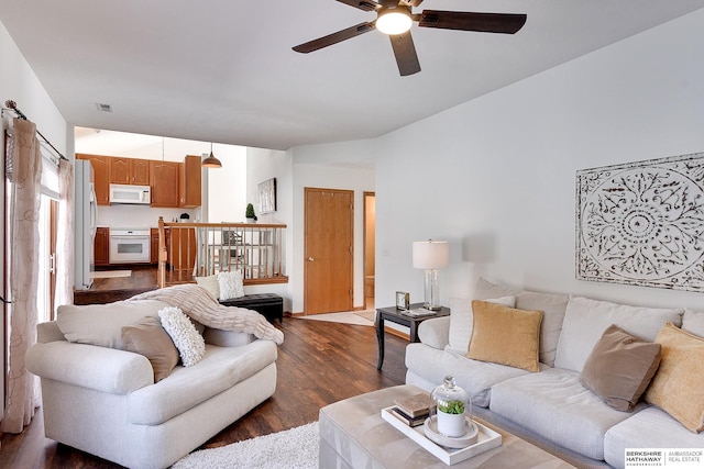 living room with ceiling fan, dark wood-style flooring, and visible vents