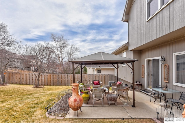 view of patio / terrace with fence and a gazebo