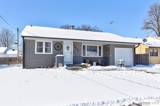 view of front of house with fence and an attached garage