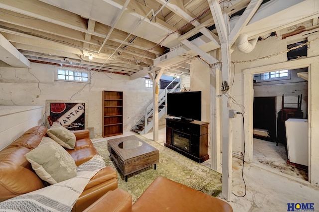 living room featuring stairway