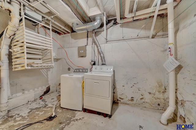 clothes washing area with washer and dryer and laundry area