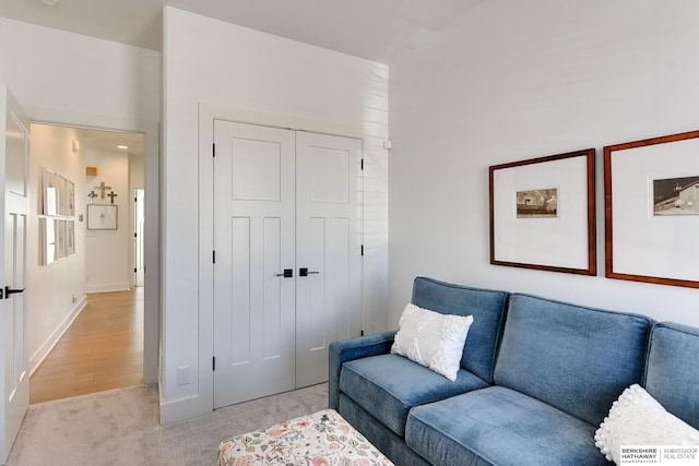 living area featuring light colored carpet