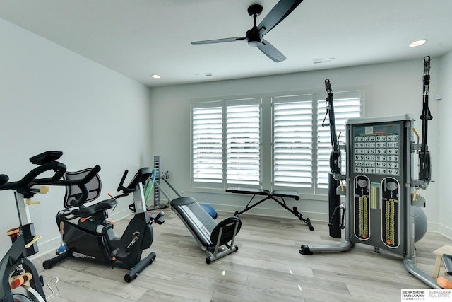 exercise area featuring recessed lighting, baseboards, visible vents, and light wood finished floors