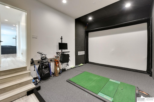 cinema with golf simulator, recessed lighting, visible vents, and baseboards