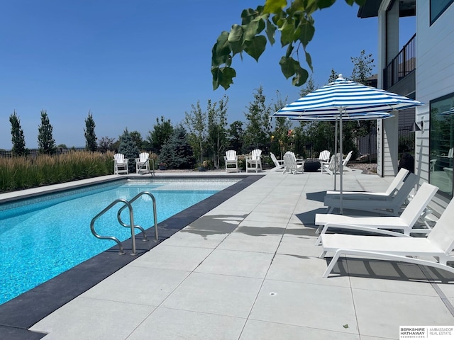 view of pool with a fenced in pool and a patio