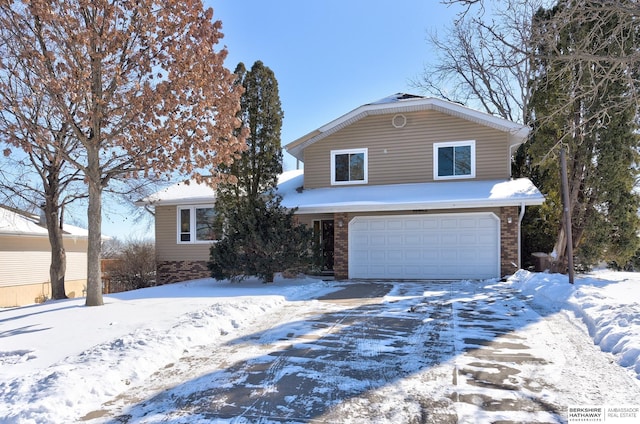 traditional-style house with brick siding and an attached garage