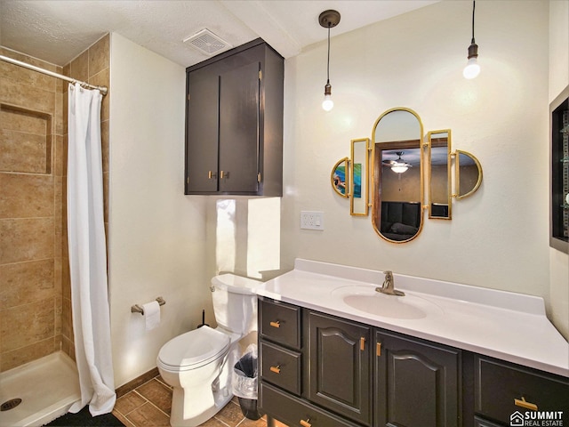 full bathroom featuring a stall shower, visible vents, vanity, and toilet