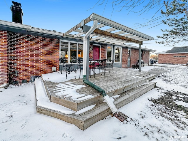 snow covered deck with outdoor dining area