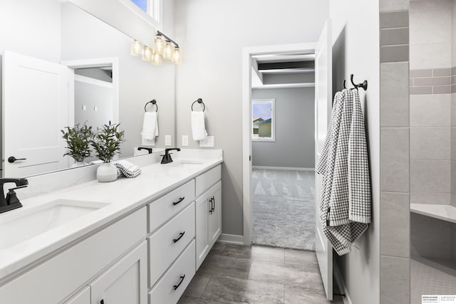 bathroom featuring double vanity and a sink