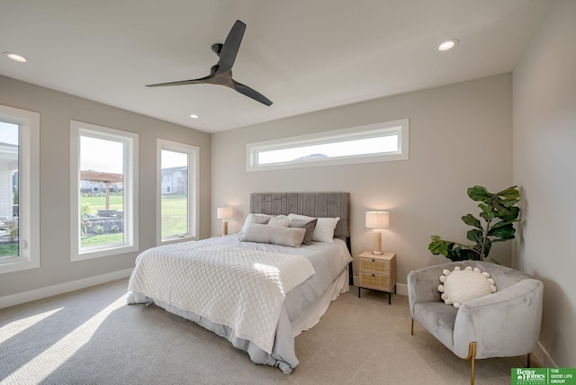 bedroom with light carpet, baseboards, a ceiling fan, and recessed lighting