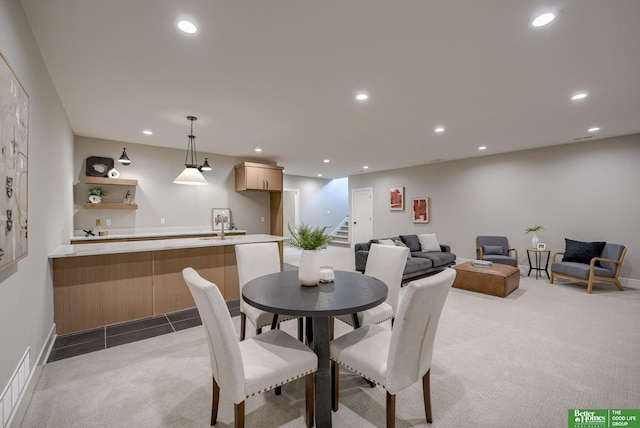 dining area with dark colored carpet, stairway, visible vents, and recessed lighting