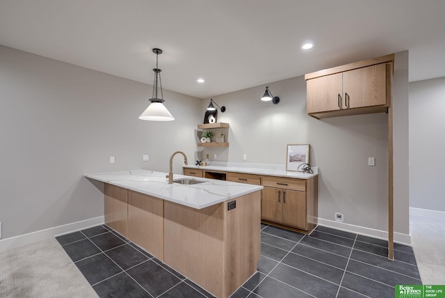 kitchen with light brown cabinets, a peninsula, dark tile patterned flooring, open shelves, and pendant lighting