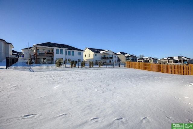 view of front of house featuring fence and a residential view