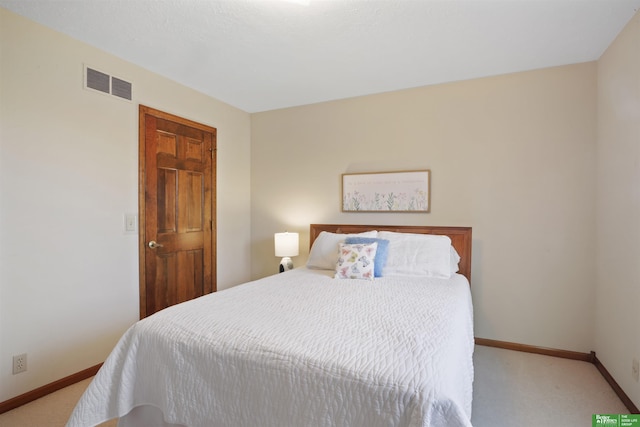 bedroom featuring light carpet, visible vents, and baseboards