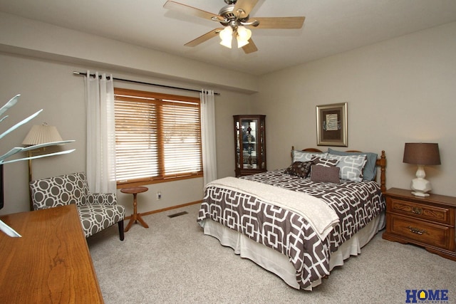 bedroom with a ceiling fan, carpet, visible vents, and baseboards