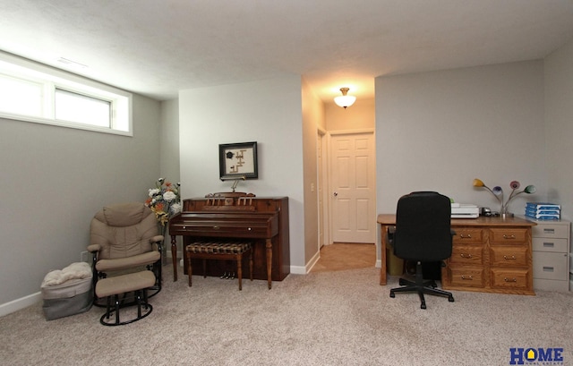 office area featuring light colored carpet and baseboards