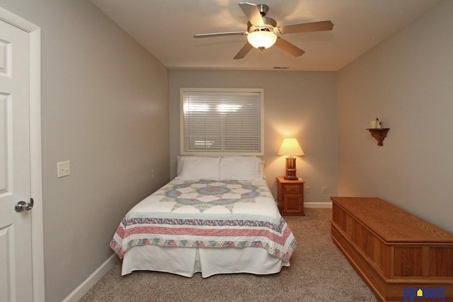 bedroom featuring ceiling fan, carpet floors, visible vents, and baseboards