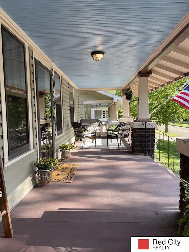 wooden deck featuring a porch