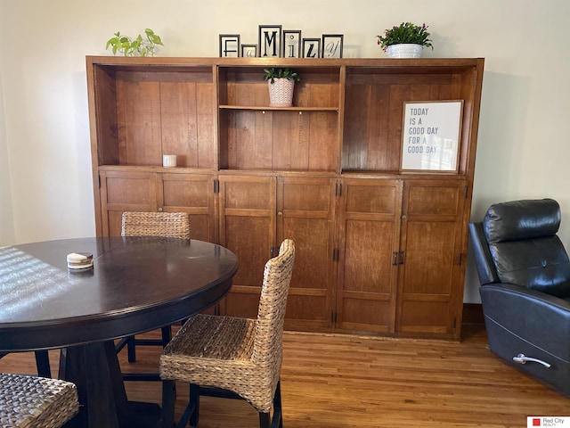 dining area featuring light wood finished floors