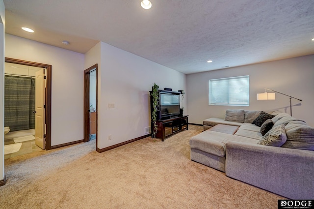 living area with light carpet, baseboards, a textured ceiling, and recessed lighting