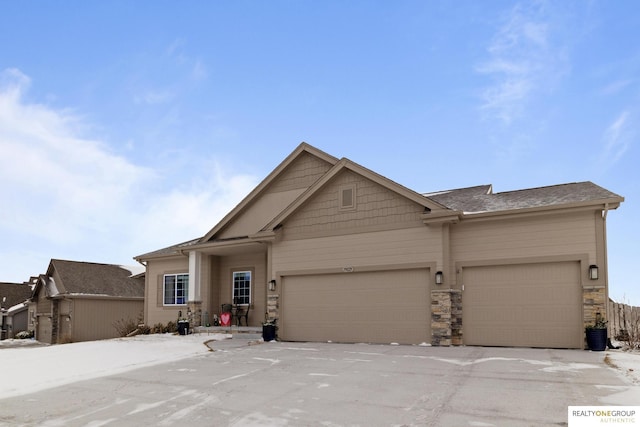 view of front of home with stone siding and an attached garage