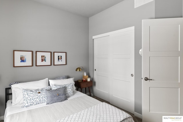 bedroom featuring a closet and visible vents