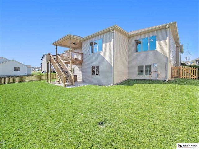 rear view of property with a fenced backyard, stairway, a ceiling fan, and a wooden deck