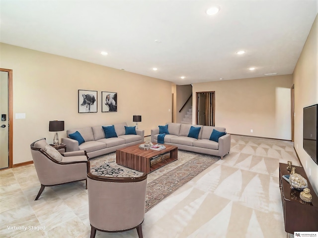 living area with baseboards, stairway, visible vents, and recessed lighting